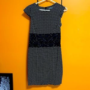 Cute stretchy dress with lace detail in middle.